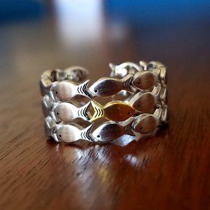 Swimming against the current - one gold fish ring